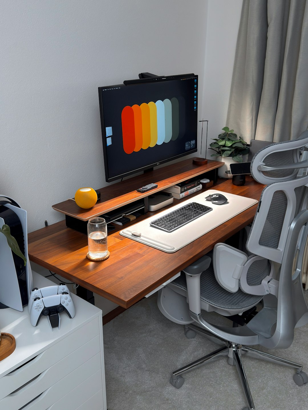 a-modern-desk-setup-with-computer-and-gaming-console-6se1a7uzug0